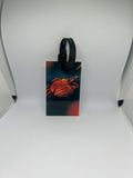 Flaming basketball luggage tag with dark teal and red fire design and black strap