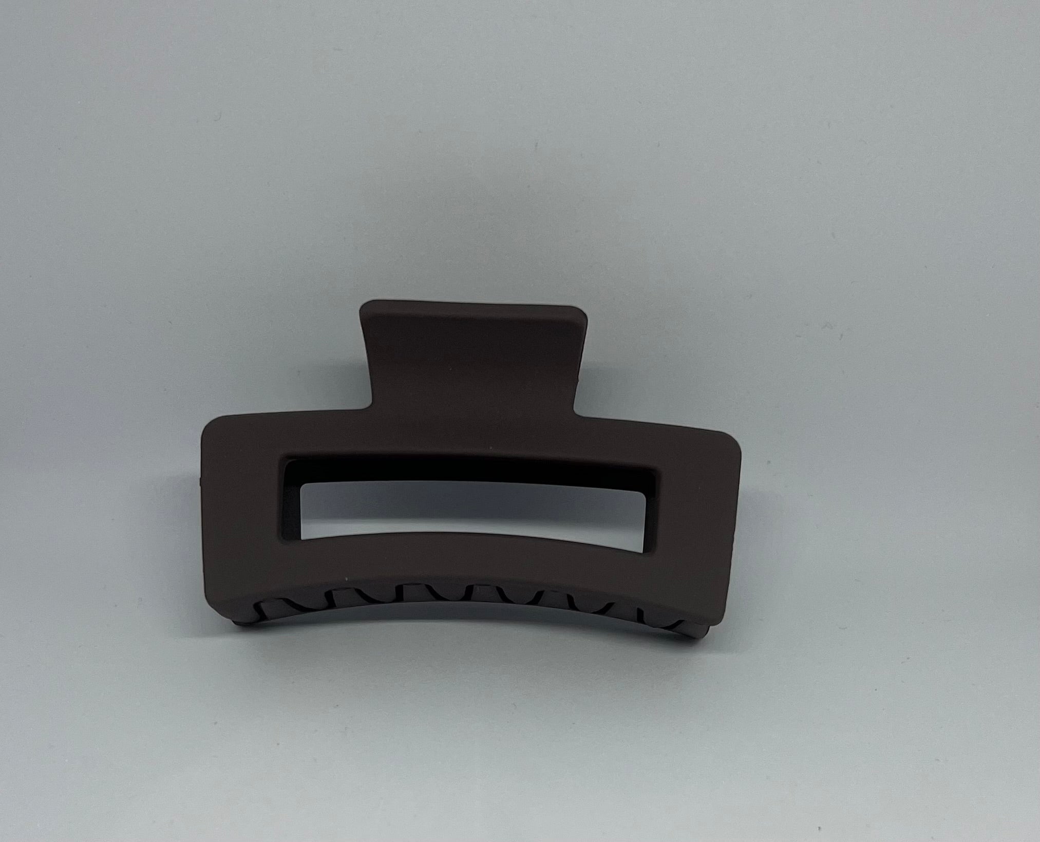 Dark brown matte rectangle hair claw clip with open design and strong grip teeth