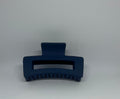 Navy blue matte rectangle hair claw clip with open design and strong grip teeth