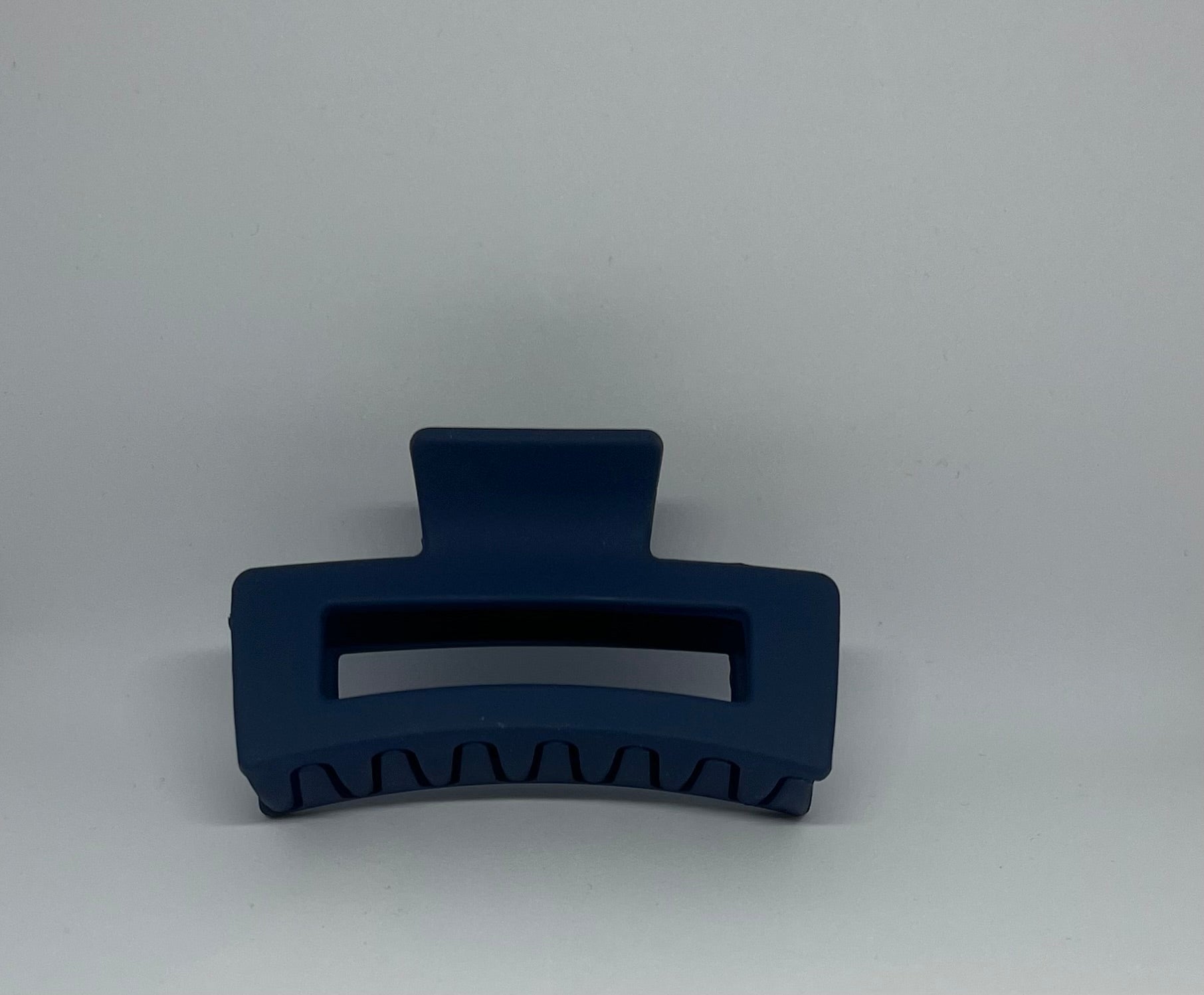 Navy blue matte rectangle hair claw clip with open design and strong grip teeth