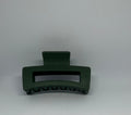 Forest green matte rectangle hair claw clip with open design and strong grip teeth
