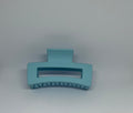 Sky blue matte rectangle hair claw clip with open design and strong grip teeth
