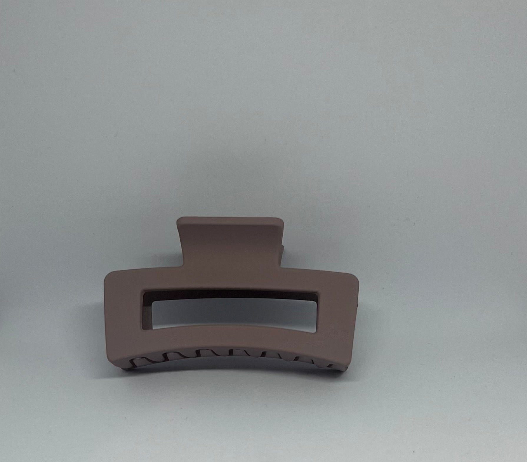 Warm taupe matte rectangle hair claw clip with open design and strong grip teeth