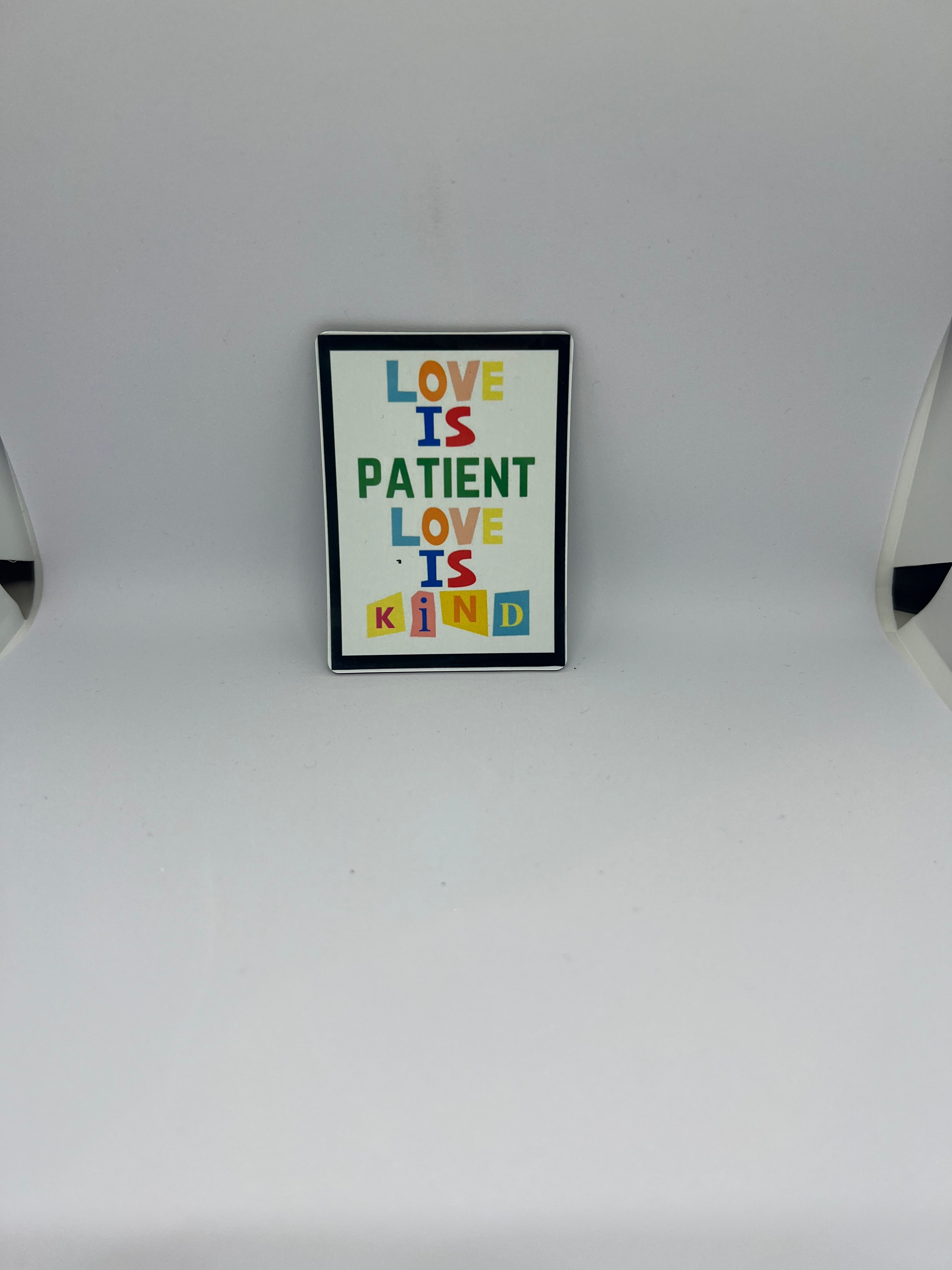 Love Is Patient Love Is Kind colourful mixed-font magnet with black border