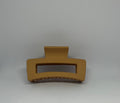 Mustard yellow matte rectangle hair claw clip with open design and strong grip teeth