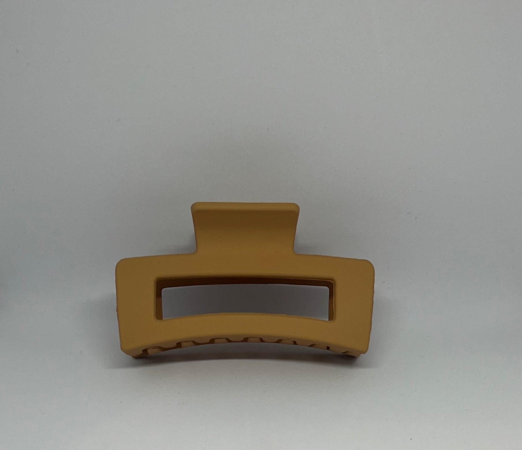 Mustard yellow matte rectangle hair claw clip with open design and strong grip teeth
