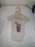 Oatmeal marle short sleeve baby onesie with bear in raincoat holding balloon illustration on 0-3 months hanger