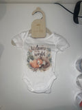White short sleeve baby onesie with watercolour sleeping fox and botanical leaves Welcome to the World print on 0-3 months hanger