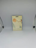 Japanese watercolour sunset luggage tag with figure on boat cherry blossom and swallows on cream background