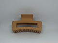 Caramel sandy tan matte rectangle hair claw clip with open design and strong grip teeth
