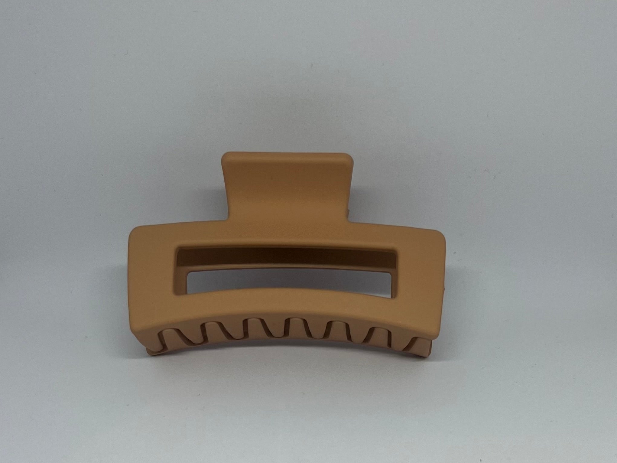 Caramel sandy tan matte rectangle hair claw clip with open design and strong grip teeth